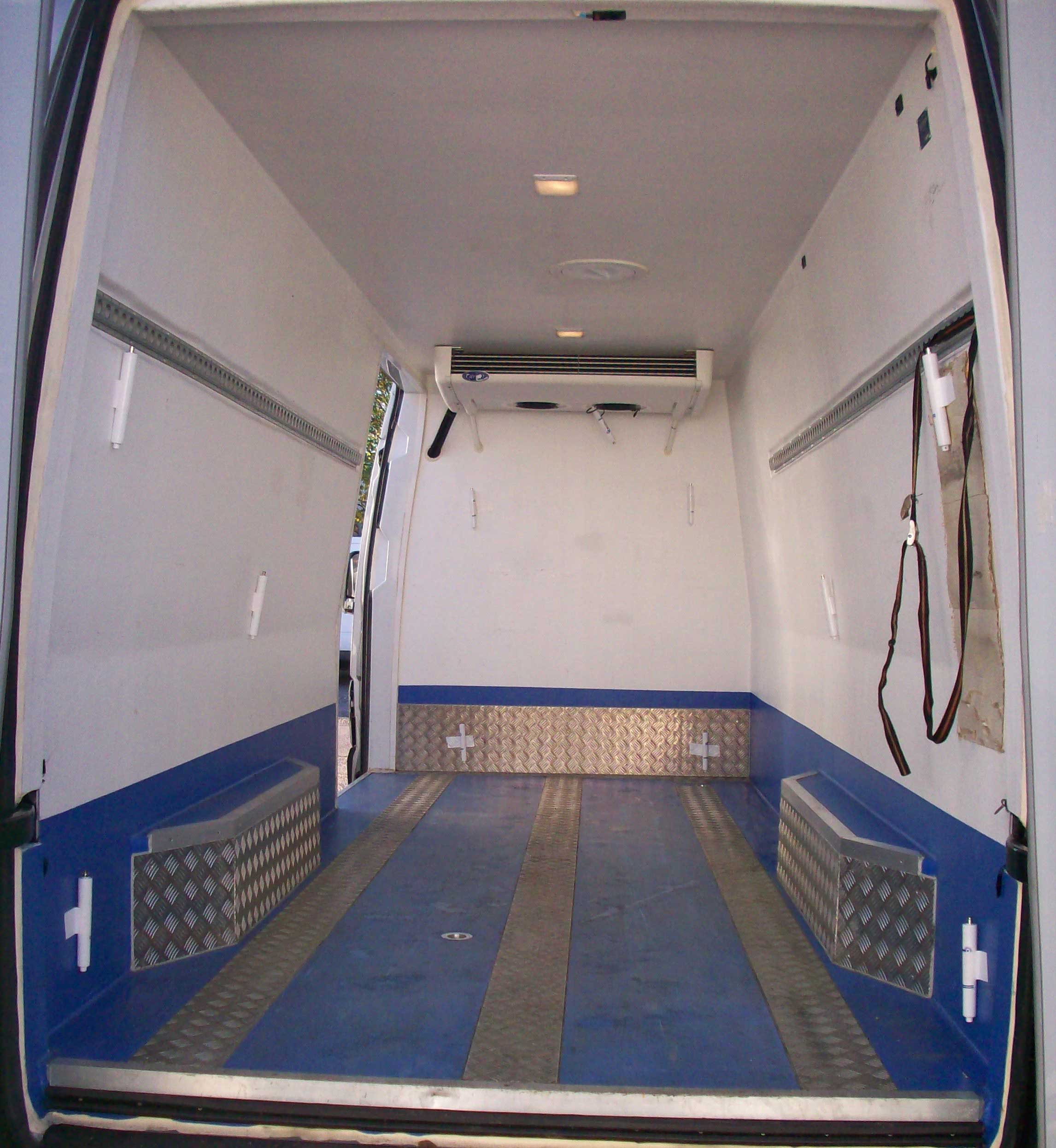 empty storage compartment of a large van
